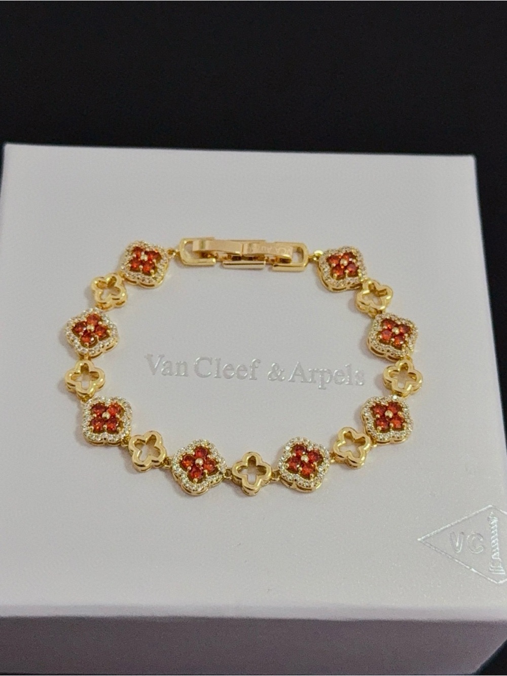 Van Cleef & Arpels Gold Bracelet with Red-Orange Floral Motifs